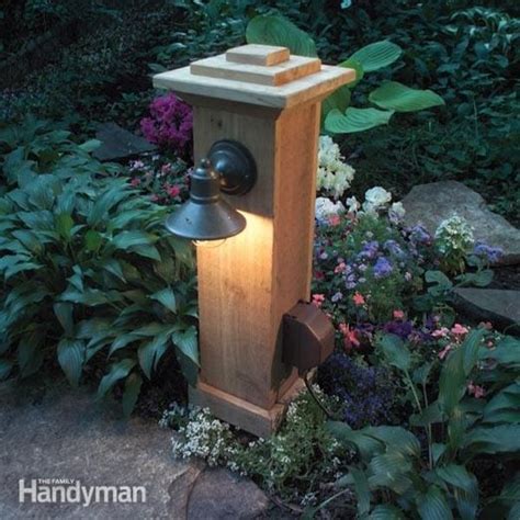 freestanding wooden box on pole outdoor electric light fixture|outdoor lighting outlet installation.